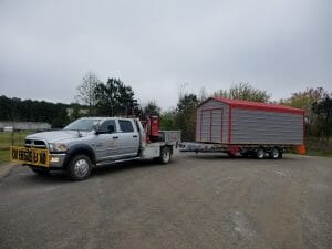 Old Hickory Metal Utility Shed delivered on trailer by pickup truck, portable backyard storage building, USA