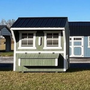 Old Hickory Chicken Coop with nesting box and metal roof on sales lot, durable backyard building for residential or farm use