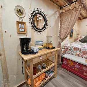 Old Hickory Utility Shed interior, cozy rustic she shed retreat with bed and coffee station, finished backyard studio