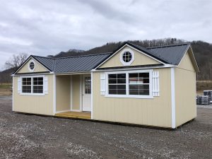 Old Hickory Utility Shed with Gable Dormers, Center Porch and metal roof, backyard storage building