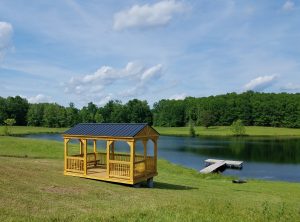 Old Hickory Cabana lakeside pavilion overlooking pond and countryside, durable outdoor shade structure for relaxing and entertaining