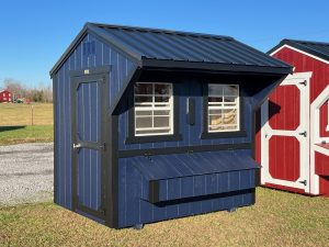 Old Hickory Chicken Coop with nesting box and metal roof on sales lot, durable backyard poultry coop for residential or farm use