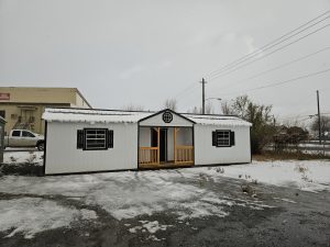 Old Hickory Utility Center Porch shed with Gable Dormer and metal roof in snowy outdoor setting, ideal for storage and workshop use