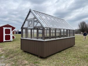 Old Hickory Greenhouse with clear panel siding and roof on dealer lot, backyard greenhouse for year-round gardening and plants