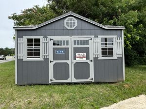 Old Hickory Utility Shed with gable dormer and double barn doors, backyard storage shed on sales lot