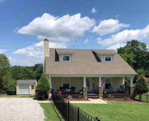 Old Hickory Utility Shed with Garage package, roll-up door and window, outdoor storage building beside home