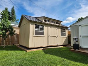 Old Hickory Utility Shed Dormer with transom windows and metal roof, backyard storage shed ideal for homes and gardens